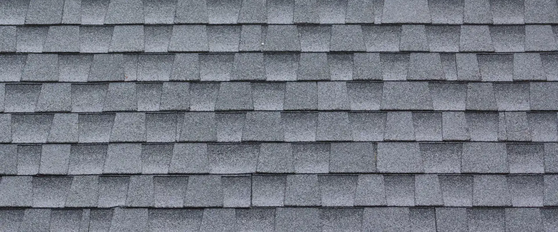 grey asphalt tiles roofing of a house